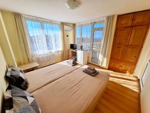 Postel nebo postele na pokoji v ubytování Hotel Bobchev