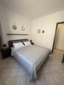 Postel nebo postele na pokoji v ubytování ATHOS APARTMENT