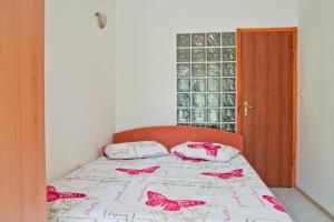Ένα ή περισσότερα κρεβάτια σε δωμάτιο στο apartman leo