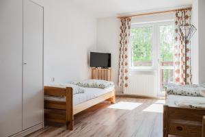 Gościniec Adam客房内的一张或多张床位