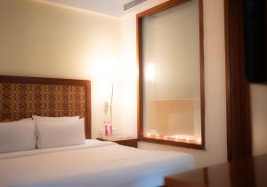 Ein Bett oder Betten in einem Zimmer der Unterkunft The Sky Imperial, Jaipur