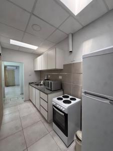 Η κουζίνα ή μικρή κουζίνα στο Departamento céntrico +4 φωτογραφίες