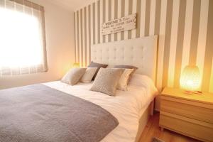 Una cama o camas en una habitación de Apartamento en Mogán 5 min playa