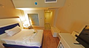 Postel nebo postele na pokoji v ubytování Mara Palas Hotel