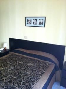 Кровать или кровати в номере Hotel Milanesina