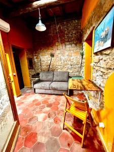 a living room with a couch and a table at Borgo Castello Sidra SG in Giulianello
