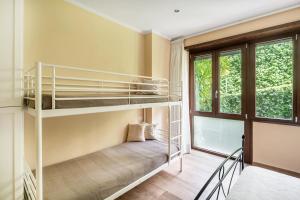 a bedroom with bunk beds and a window at ROMAN DREAM I in Rome