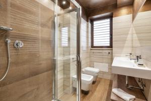 a bathroom with a shower and a toilet and a sink at ROMAN DREAM I in Rome +22 photos