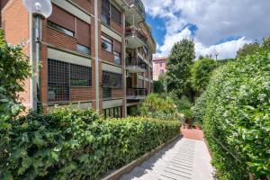 an apartment building with a walkway in front of it at ROMAN DREAM I in Rome