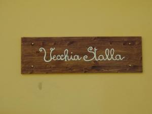 a sign on a wall that says peoriaolis at La Vecchia Stalla B&B in Narni