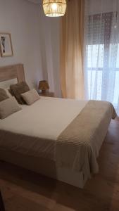 Cama o camas de una habitación en Apartamentos Vino y Camino