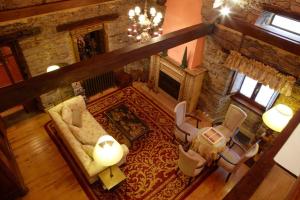 an overhead view of a living room with a fireplace at Hotel Rural Casa Xusto in La Caridad