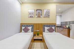 Postel nebo postele na pokoji v ubytování Wandr Hotel Medicity Gurugram, Near Medanta Hospital