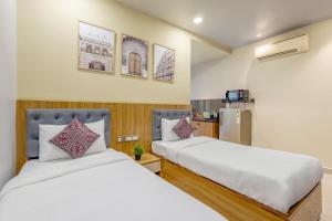 Postel nebo postele na pokoji v ubytování Wandr Hotel Medicity Gurugram, Near Medanta Hospital