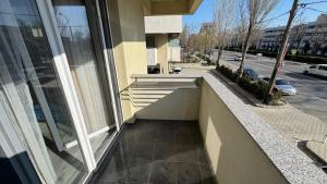 a balcony of a building with a view of a street at Evo Moonlight by the sea in Mamaia