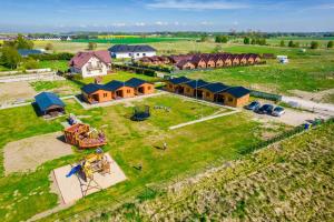 an aerial view of a house in a field at VIKING Gąski in Gąski
