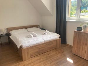 Postel nebo postele na pokoji v ubytování Apartmán JUZION skiareál Bukova hora