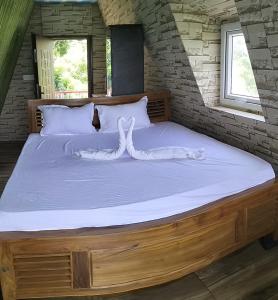 En eller flere senge i et værelse på Dusk Vistas Resort