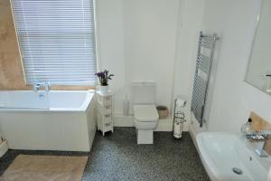 A bathroom at Upper St Giles Apartments 