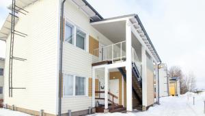 a house with a staircase on the side of it at Convenient Apartment for 4 with Sauna in Porvoo