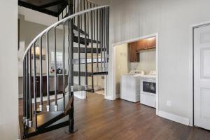 a staircase in a room with a kitchen at Haymount Hideaway in Fayetteville +27 photos