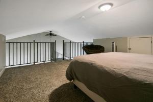 a bedroom with a bed and a chair in it at Haymount Hideaway in Fayetteville