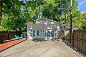 a small white house with a fence at Haymount Hideaway in Fayetteville