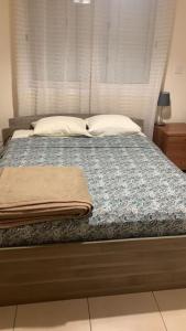 Postel nebo postele na pokoji v ubytování Bungalow Yanna