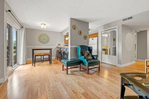 a living room with a chair and a table at Windy Oaks Condo by Avada Properties in Gatlinburg