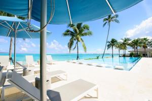 a view of the infinity pool at the resort at Cable Beach Condo Large private patio with BBQ in Nassau