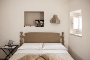 Letto o letti in una camera di Bianko EcoChic