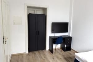 TV a/nebo společenská místnost v ubytování ProStays Apartment in Stolberg- 3 Schlafzimmer - 4 Betten