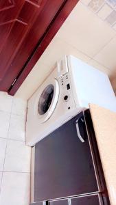 Η κουζίνα ή μικρή κουζίνα στο Cozy haven in the Heart of city