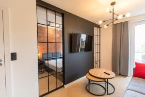 Televízia a/alebo spoločenská miestnosť v ubytovaní Rent40 Apartamenty Aura 2 Gdańsk Old Town