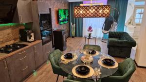 a dining room with a table and chairs in a kitchen at Ferienhaus Mefady Jünkerath in Jünkerath