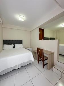 Ένα ή περισσότερα κρεβάτια σε δωμάτιο στο Hotel Tropical Paracatu Ereli
