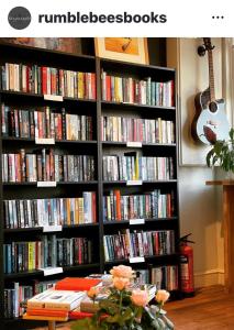 a book shelf filled with lots of books at Upstairs at Rumblebees in Felsted Station +21 photos