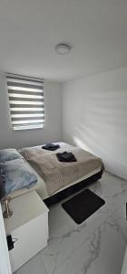 Postelja oz. postelje v sobi nastanitve Apartman Stefan Tomić-Srebrno jezero