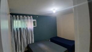 Giường trong phòng chung tại Amplo apt 2 Qdras da Praia do Pontal