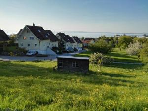 a group of houses in a field of grass at Sunrise Apartment in Staad