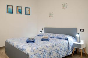 a bedroom with a bed with two bags on it at B&B Borgo Sabelli - Costa dei Trabocchi in Casalbordino