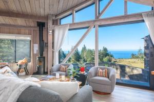 a living room with a view of the ocean at Architectural Treasure - Private Hot Tub in Sea Ranch