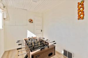 a room with a bunch of chairs in it at Private HotTub GameRoom and Fenced Backyard in Ogden