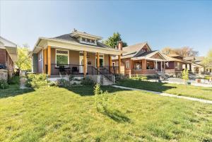 a house with a lawn in front of it at Private HotTub GameRoom and Fenced Backyard in Ogden +47 photos
