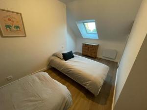 Una cama o camas en una habitación de Gîte de penhaudan 1