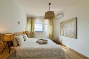 a bedroom with a bed and a large window at Casa en la montaña in Montana la Data +24 photos