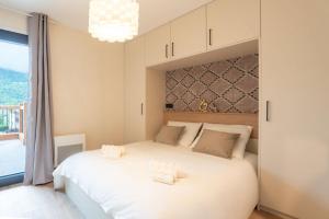 Postel nebo postele na pokoji v ubytování L'Auberge - Appartement cosy 3 chambres