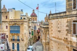 a view of an alley between buildings at Hughesville Birgu in Birgu