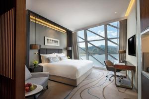 Postel nebo postele na pokoji v ubytování Sunrise Kempinski Hotel Beijing
