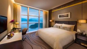 Postel nebo postele na pokoji v ubytování Sunrise Kempinski Hotel Beijing